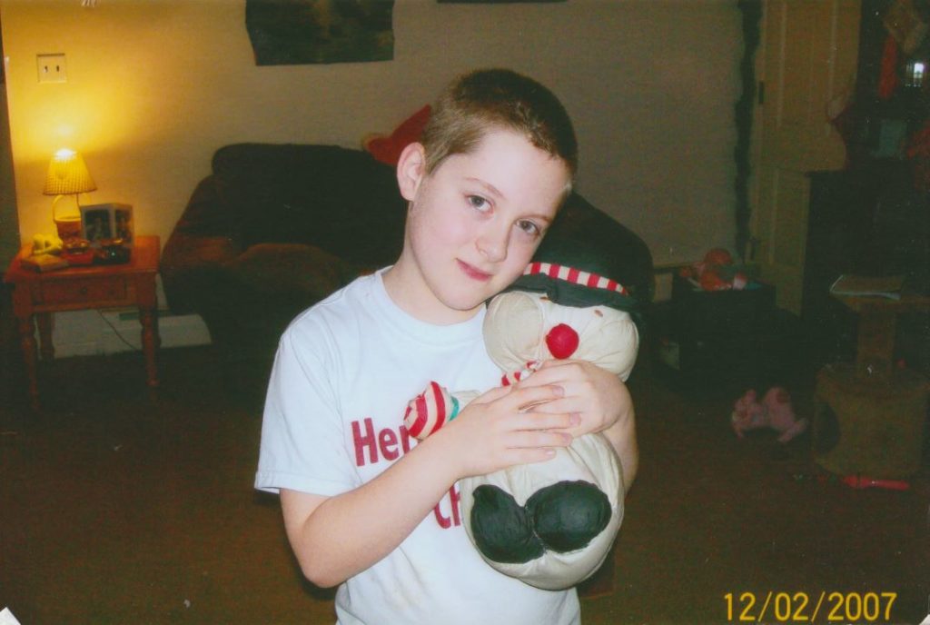 Me at age 8 holding Snowman
