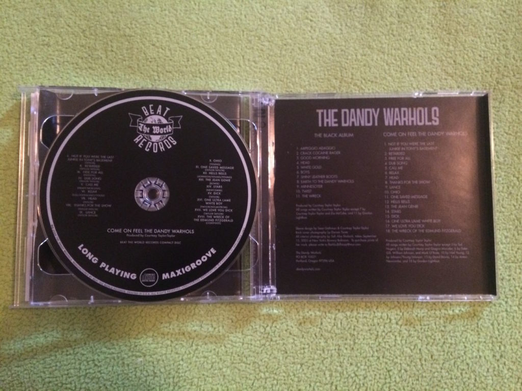 The second disc and insert of Come On Feel the Dandy Warhols