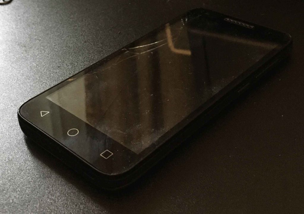 The Alcatel Raven LTE with a cracked screen.