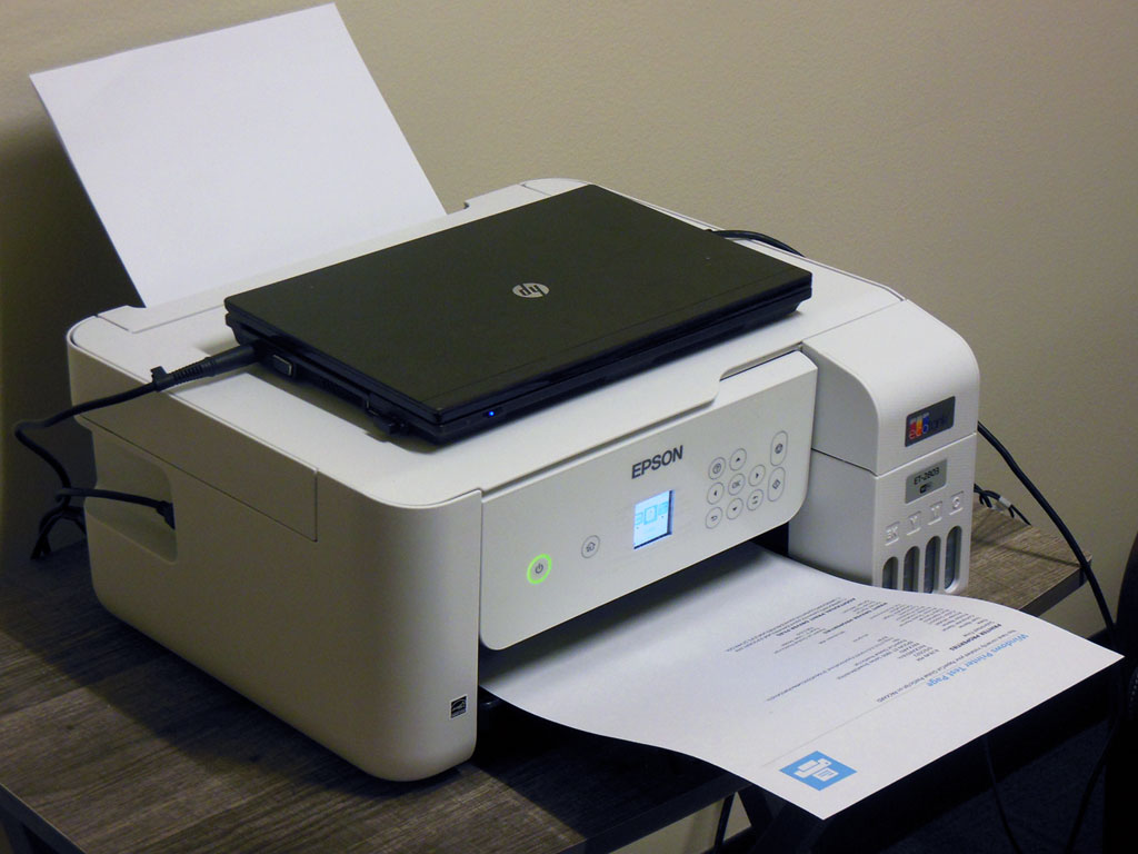 The HP Mini 5103 sat up top the Epson ET-2803 printer