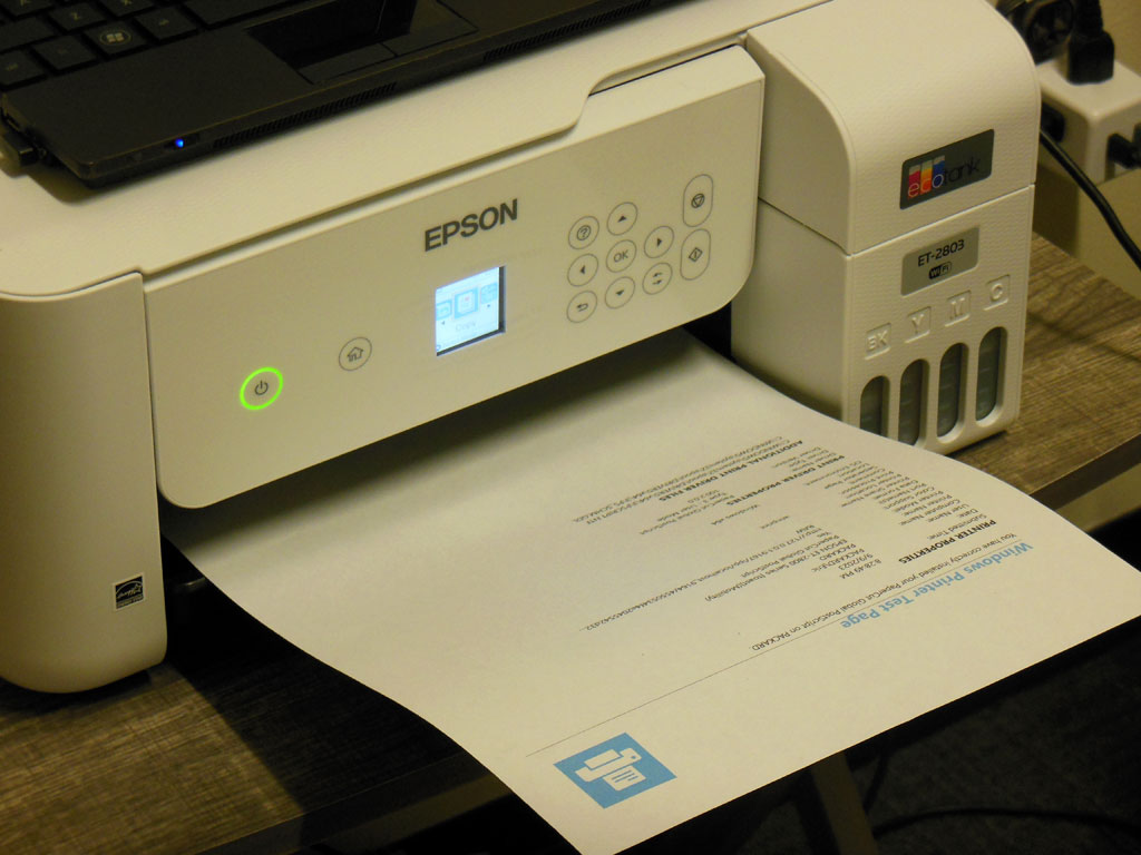 Close-up of an Epson ET-2803 printer having just printed a Windows 10 test page